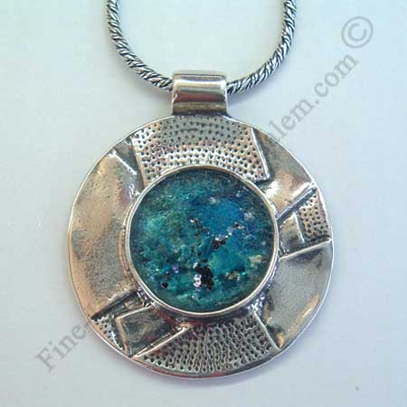 abstract design in sterling slver round pendant set with Roman glass