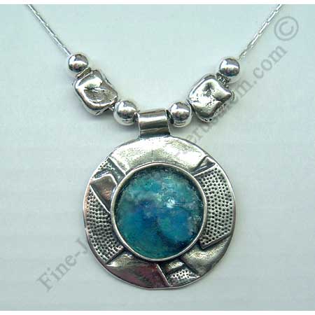 abstract design in sterling slver smaller round pendant set with Roman glass