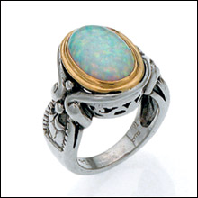 Silver & Gold ring set with an Opal