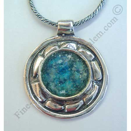 abstract design in sterling slver round pendant set with Roman glass