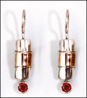 Silver and Gold earrings set with Garnets